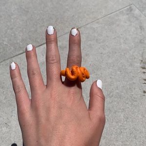 Orange swirly ring